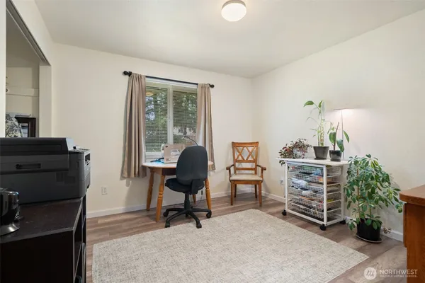 a bed room with a bed and a desk