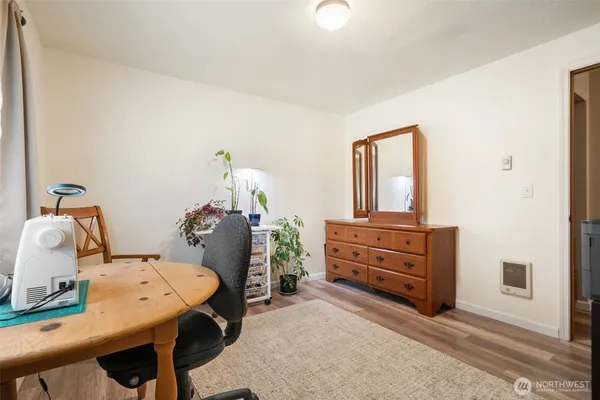 a bathroom with a sink vanity mirror and toilet