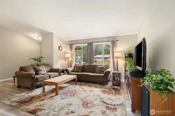 a view of a dining room with furniture window and wooden floor