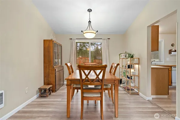 a kitchen with a stove a sink and a refrigerator