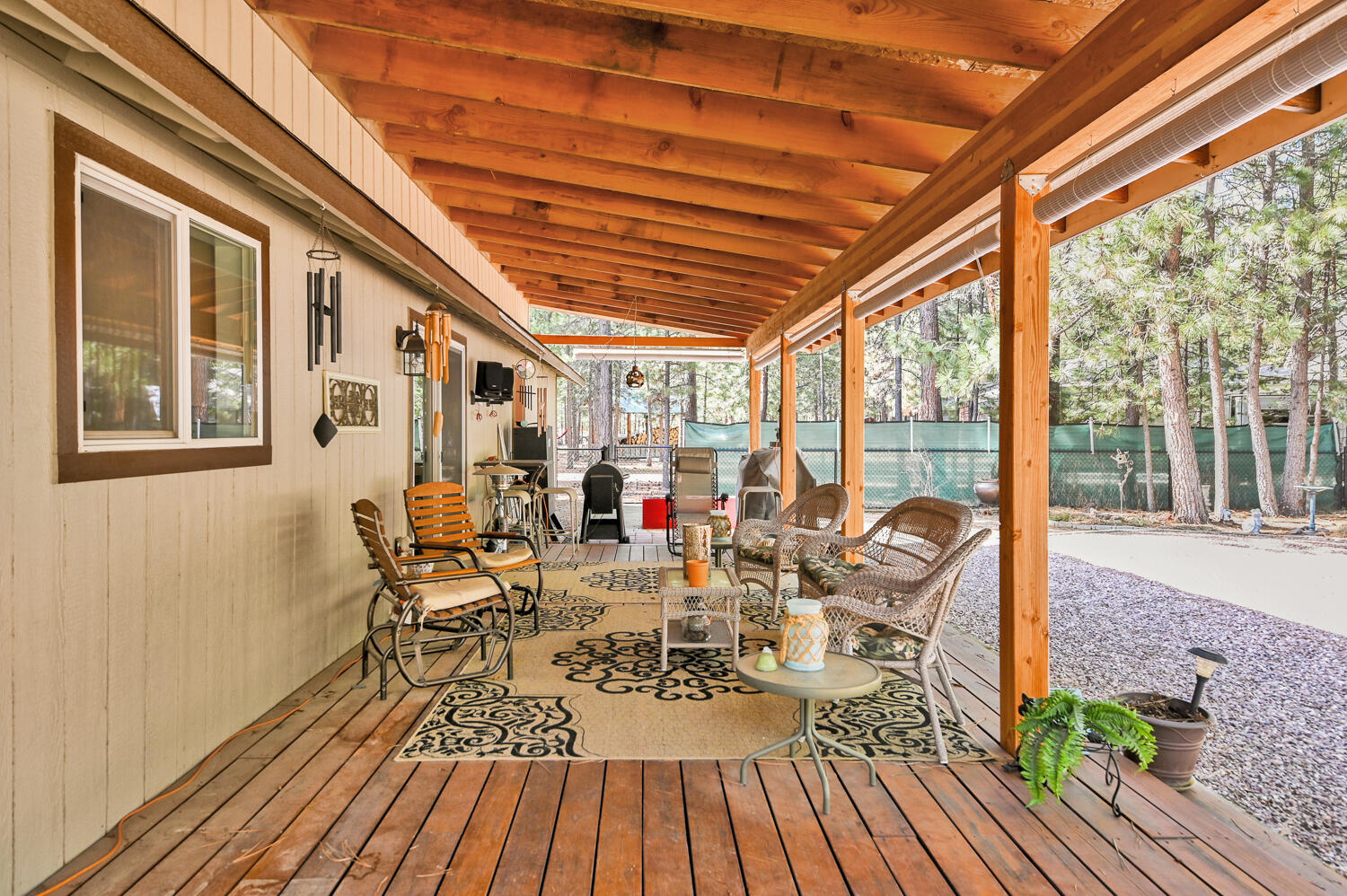 14840 Laurel Road La Pine, OR 97739 - Photo 13 of 32 a view of deck with table and chairs and wooden floor