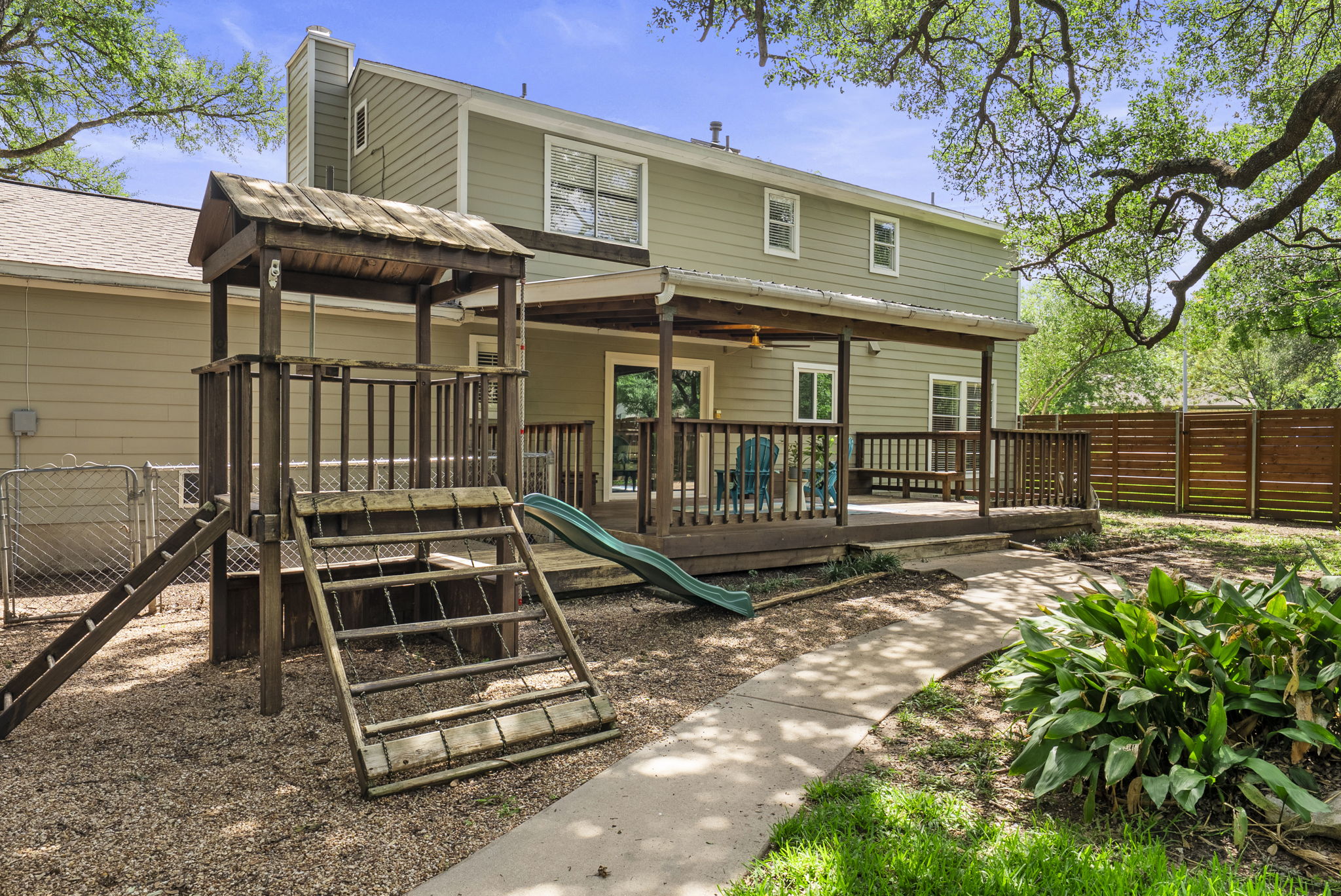 11405 Pyreneese Drive Austin, TX 78759 - Photo 31 of 37 a view of a roof deck with a small yard and wooden fence