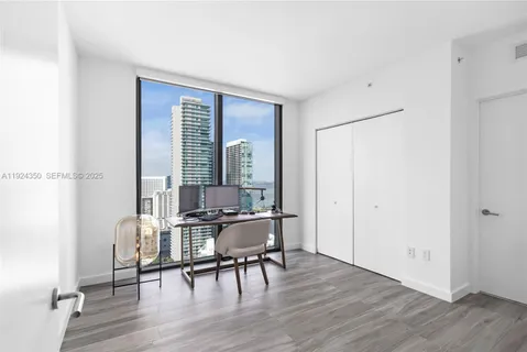 a view of a livingroom with furniture and wooden floor