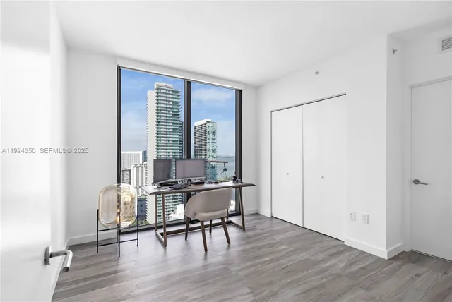 a view of a livingroom with furniture and wooden floor