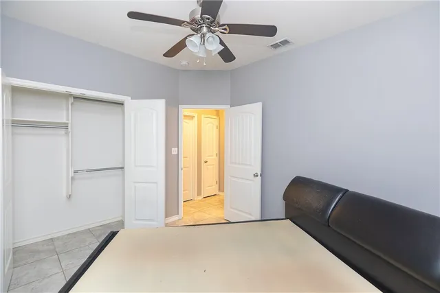 a view of room with window and ceiling fan