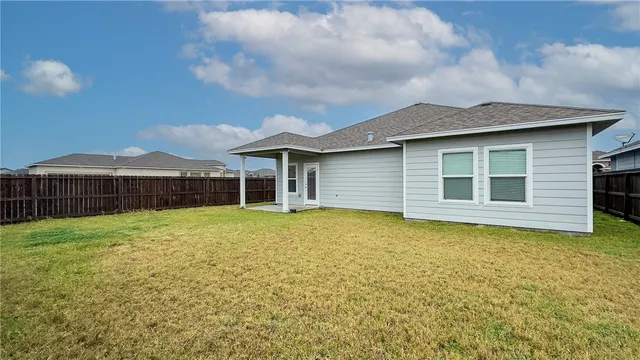 a view of backyard with green space