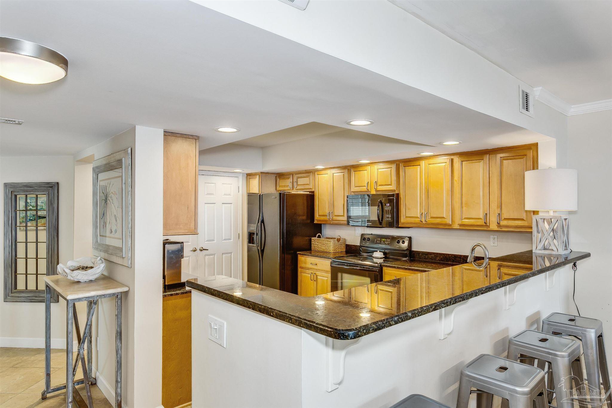 16285 Perdido Key Drive, Unit 625 Perdido Key, FL 32507 - Photo 14 of 49 a kitchen with counter top space and living room