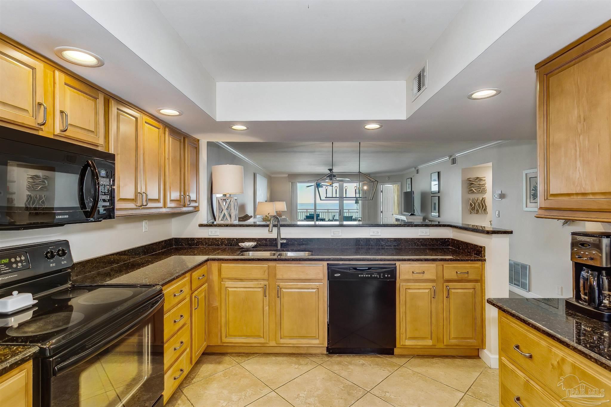 16285 Perdido Key Drive, Unit 625 Perdido Key, FL 32507 - Photo 15 of 49 a kitchen with a sink appliances and cabinets