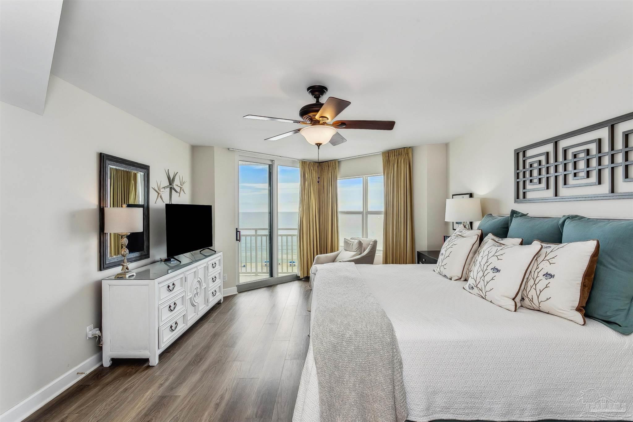 16285 Perdido Key Drive, Unit 625 Perdido Key, FL 32507 - Photo 20 of 49 a spacious bedroom with a bed and a flat screen tv
