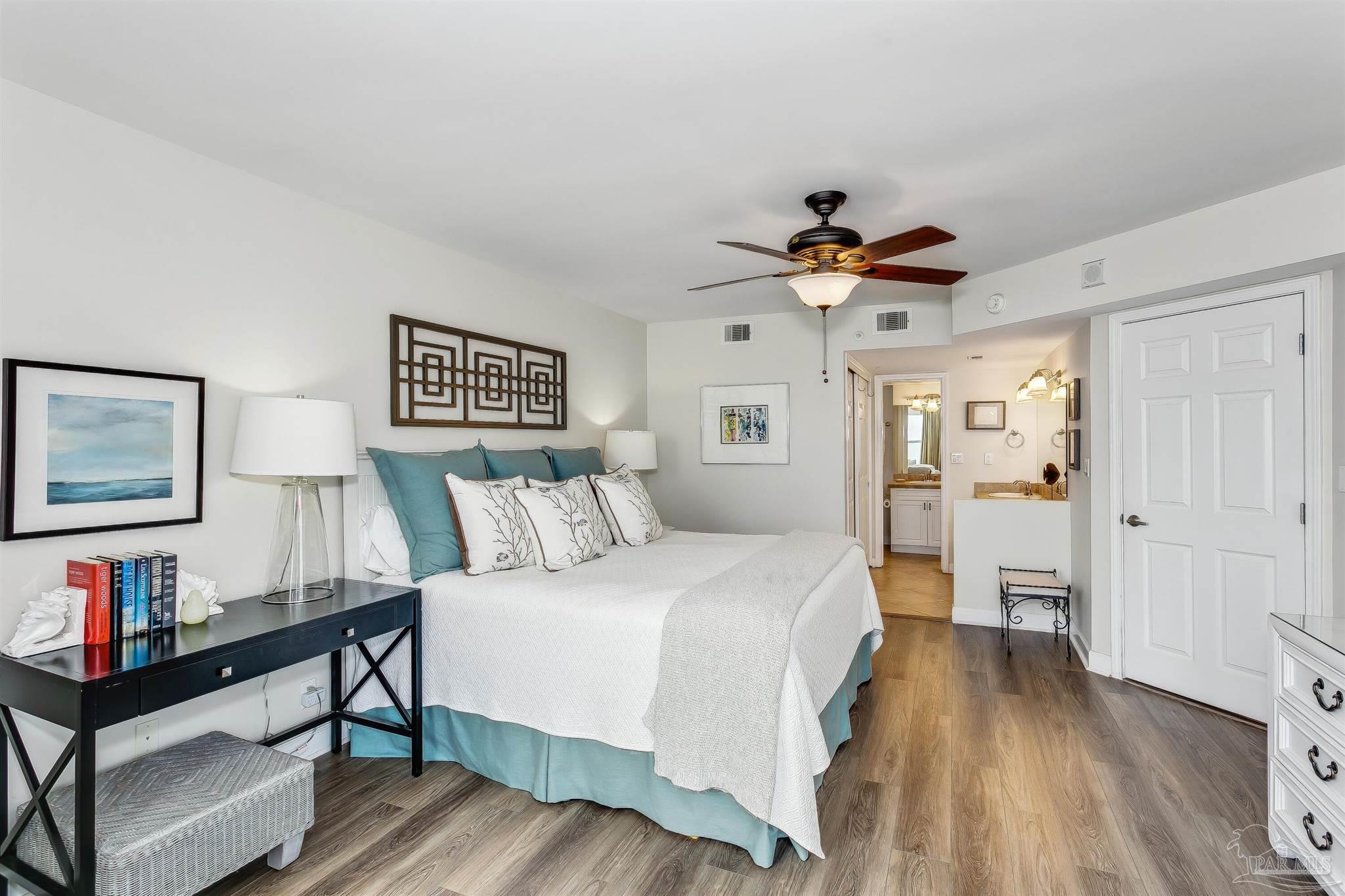 16285 Perdido Key Drive, Unit 625 Perdido Key, FL 32507 - Photo 21 of 49 a bed room with a bed and a chandelier