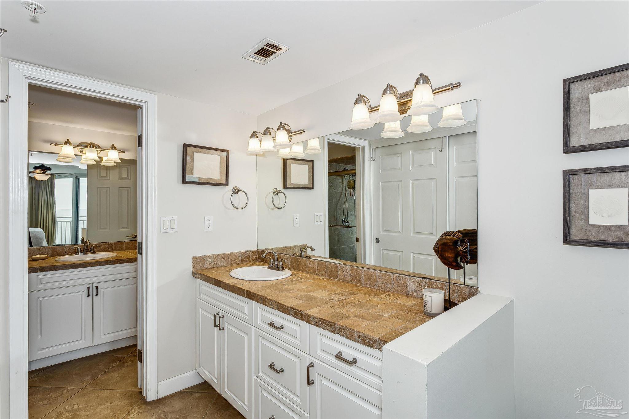 16285 Perdido Key Drive, Unit 625 Perdido Key, FL 32507 - Photo 22 of 49 a bathroom with a sink and mirror