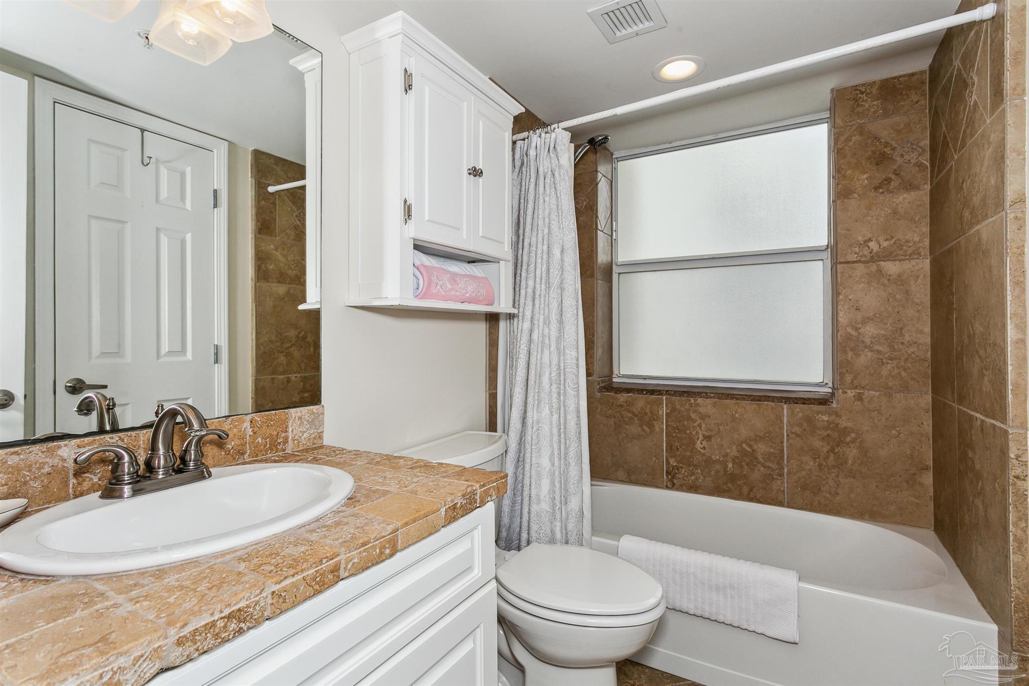 16285 Perdido Key Drive, Unit 625 Perdido Key, FL 32507 - Photo 25 of 49 a bathroom with a granite countertop sink toilet and shower