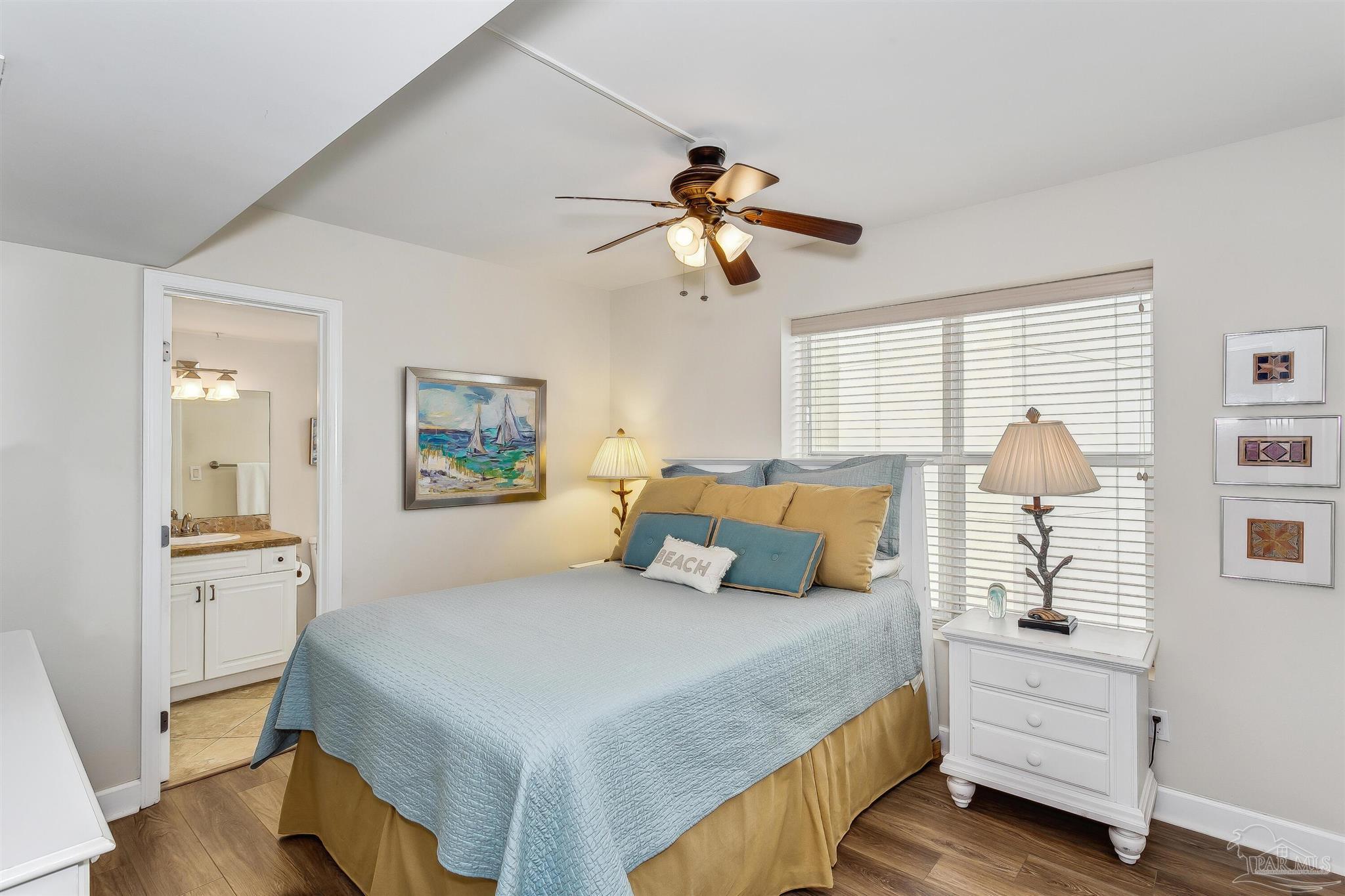 16285 Perdido Key Drive, Unit 625 Perdido Key, FL 32507 - Photo 26 of 49 a bedroom with a bed and a chandelier