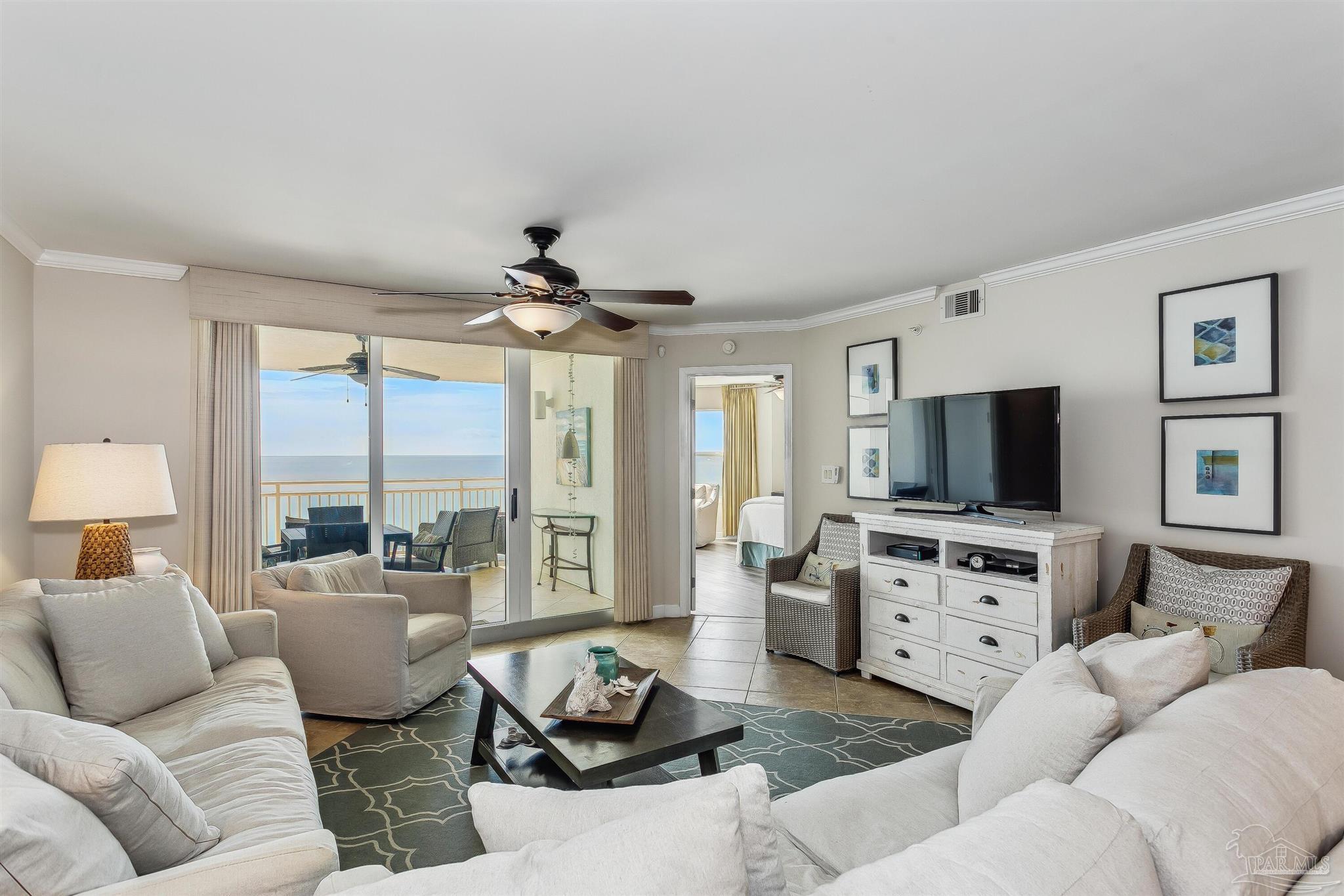 16285 Perdido Key Drive, Unit 625 Perdido Key, FL 32507 - Photo 3 of 49 a living room with furniture and a flat screen tv