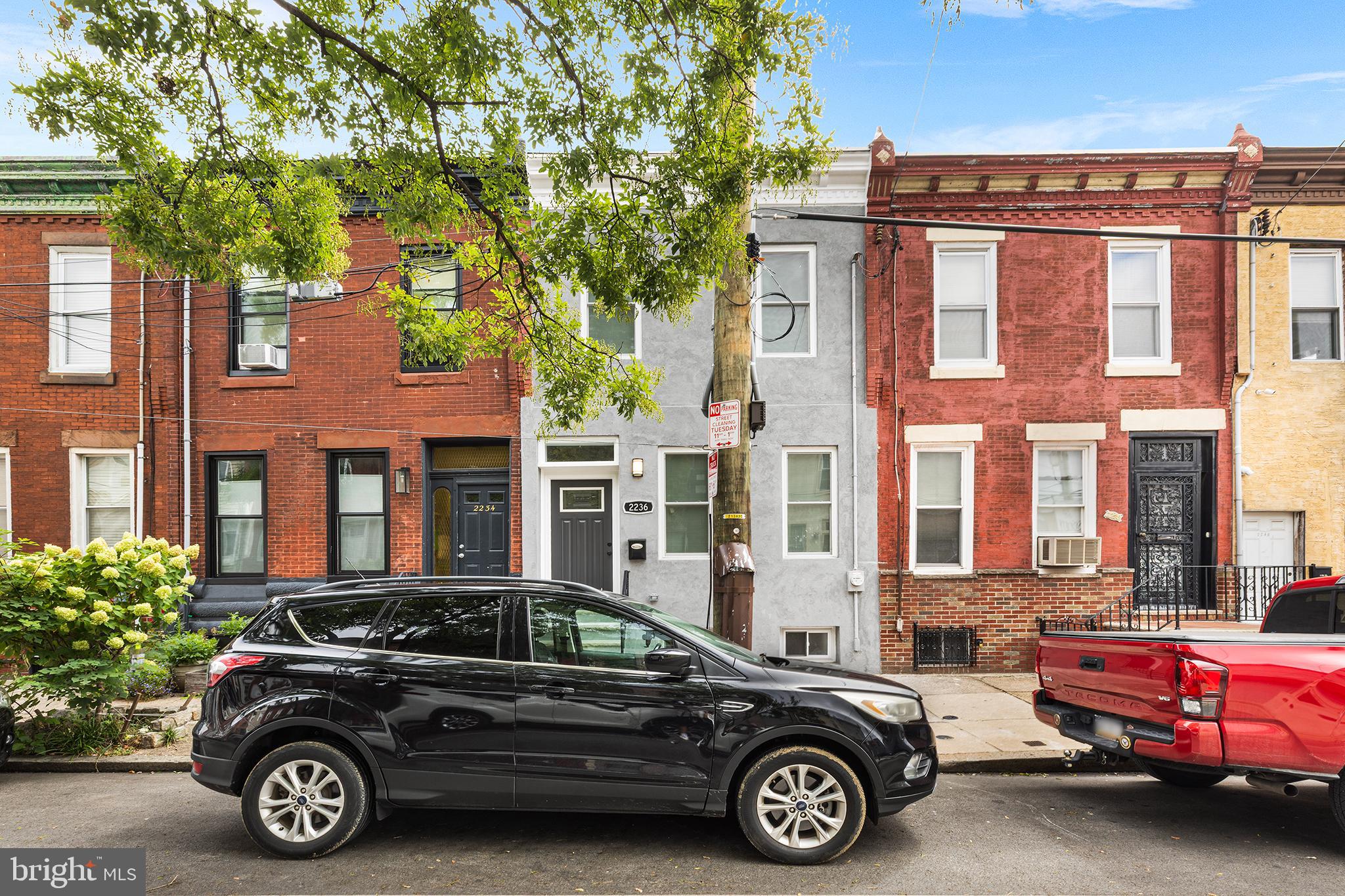 2236 Tasker Street Philadelphia, PA 19145 - Photo 1 of 26 a car parked in front of a house