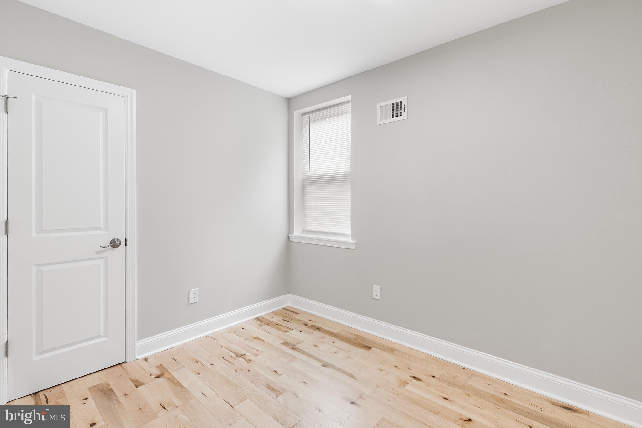 2236 Tasker Street Philadelphia, PA 19145 - Photo 15 of 26 a view of a room with wooden floor and closet