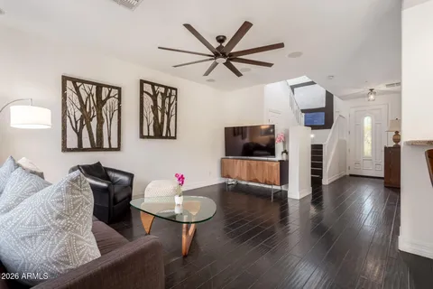 a living room with furniture and a large window