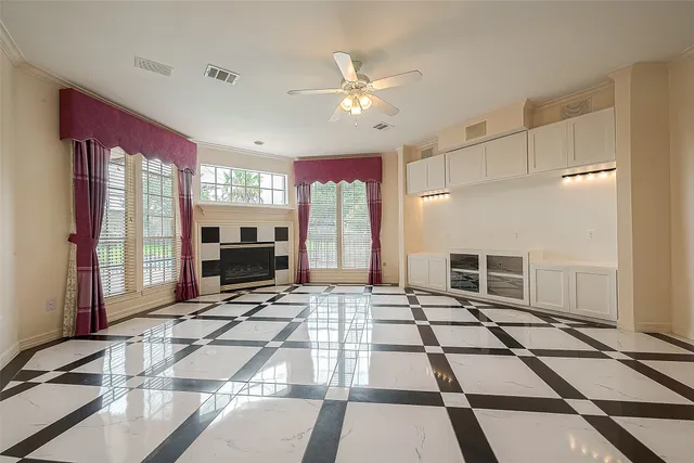 a view of open kitchen with wooden floor and electronic appliances