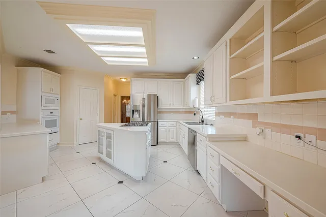 a spacious bathroom with a double vanity sink and a mirror