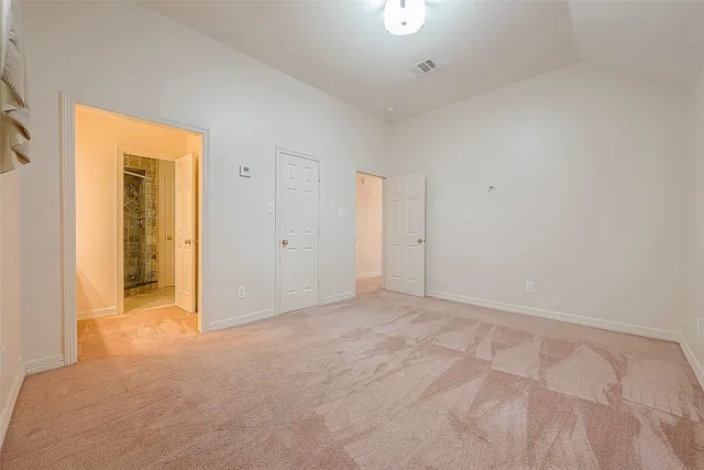 a large white bathroom with a large tub sink vanity and granite