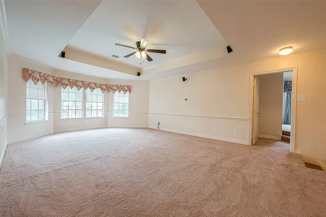 a view of a house with backyard and porch