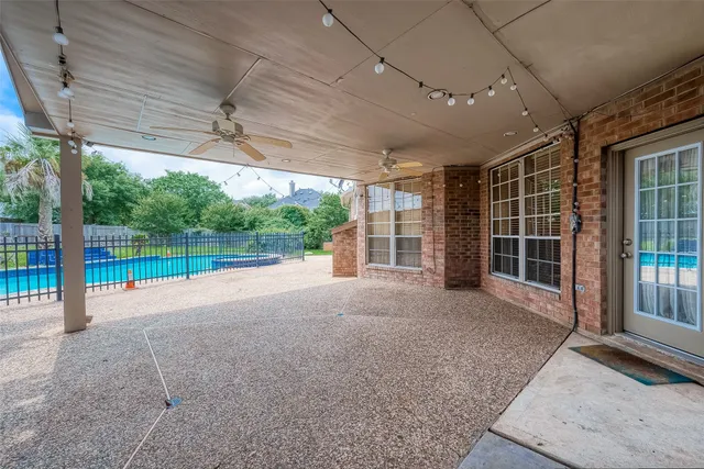 a view of a house with backyard and porch