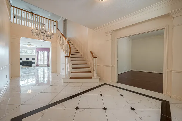 a view of a livingroom with wooden floor and a window