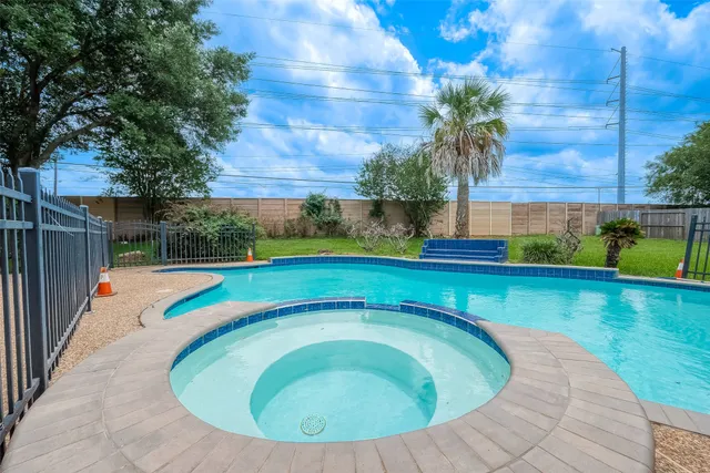 a view of a yard with a house in the background