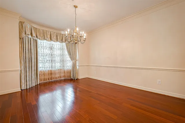 a view of a livingroom with wooden floor