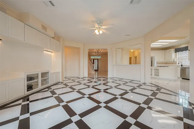 a living room with patio furniture and a fireplace
