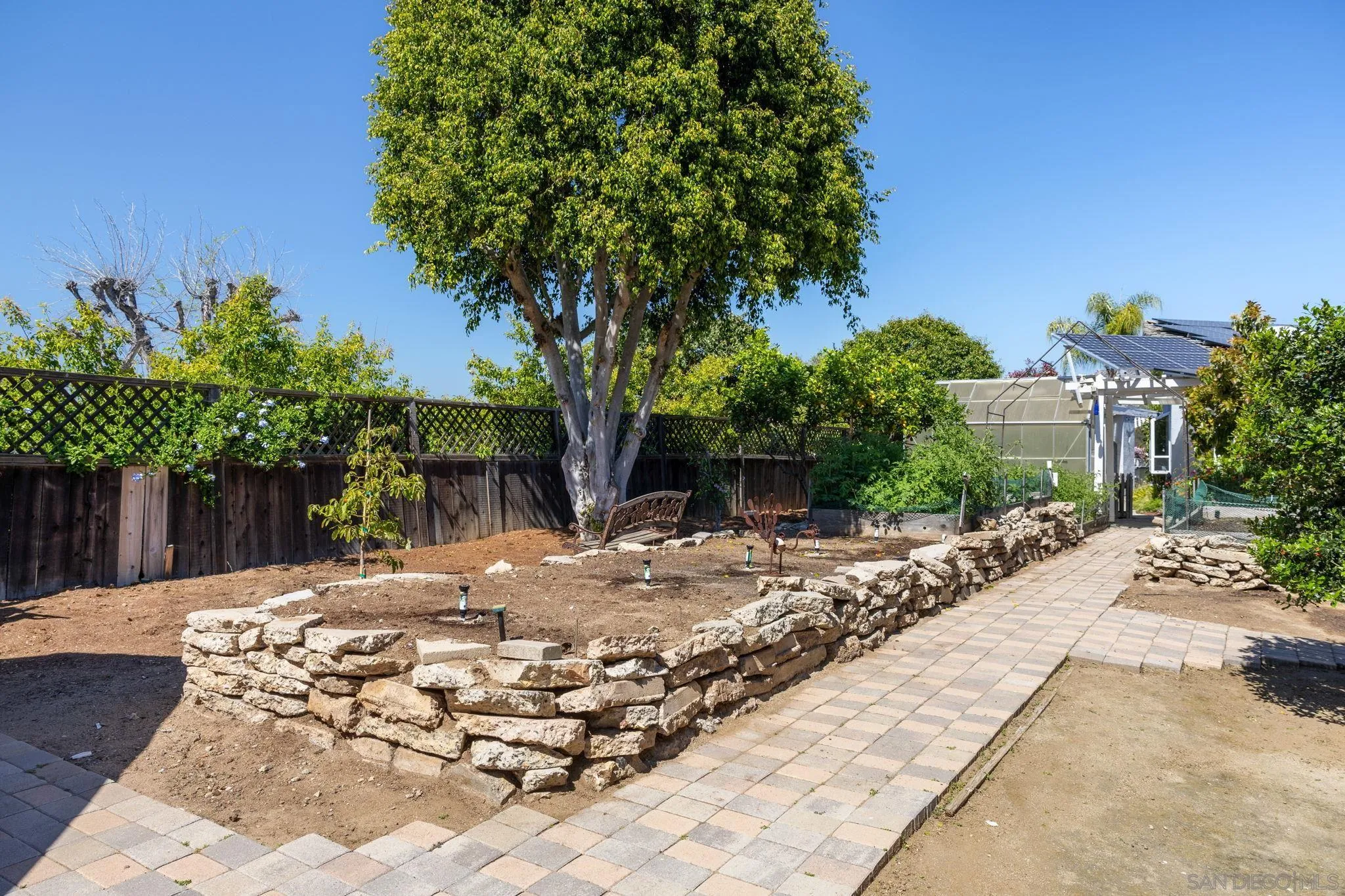 16334 Woodson View Road Poway, CA 92064 - Photo 54 of 73 a view of a backyard with plants and trees