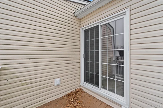 a view of a house with a yard and fence