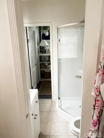 a view of a backyard with wooden fence