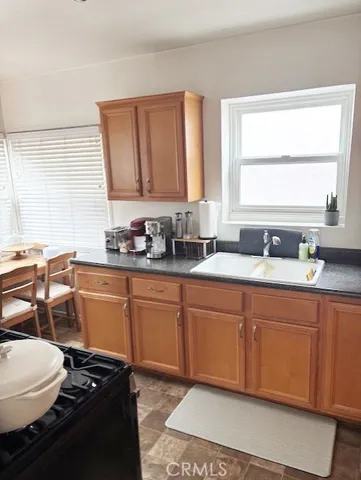 a livingroom with workspace and a window
