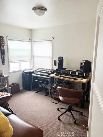 a bedroom with a bed and a cabinets