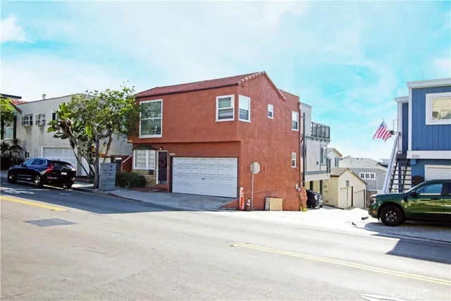 a view of a car is parked in front of a building