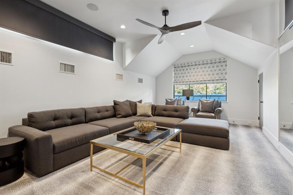 1502 Bluffview Drive Roanoke, TX 76262 - Photo 20 of 34 a living room with furniture ceiling fan and a rug