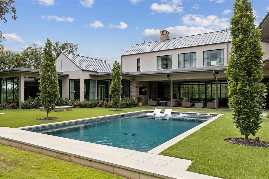 1502 Bluffview Drive Roanoke, TX 76262 - Photo 25 of 34 a view of a house with swimming pool and a yard