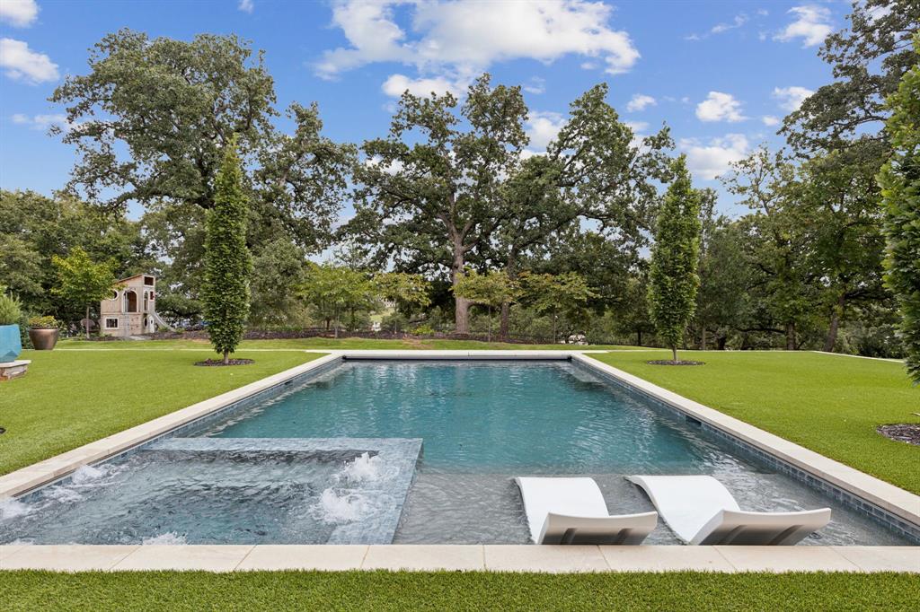 1502 Bluffview Drive Roanoke, TX 76262 - Photo 26 of 34 a view of a backyard with swimming pool