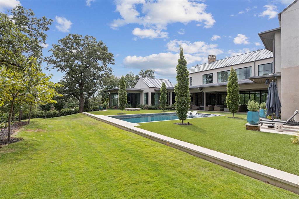 1502 Bluffview Drive Roanoke, TX 76262 - Photo 27 of 34 a view of an house with swimming pool and yard