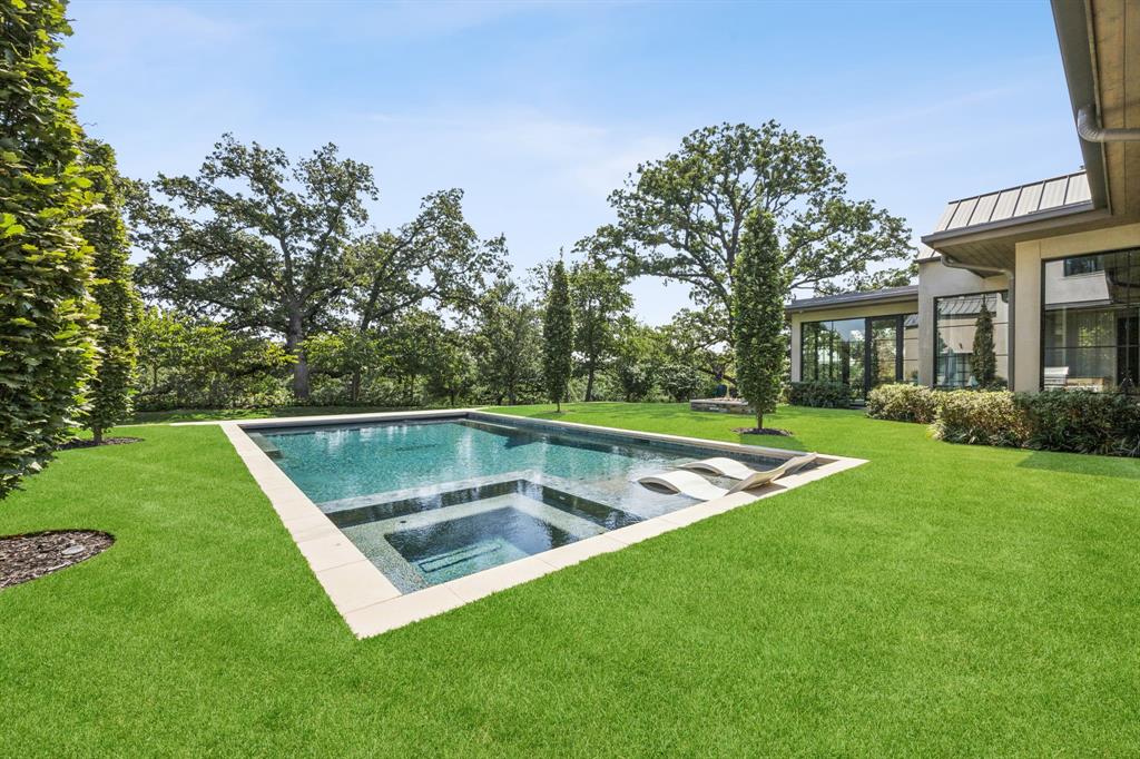1502 Bluffview Drive Roanoke, TX 76262 - Photo 28 of 34 a view of a backyard with swimming pool