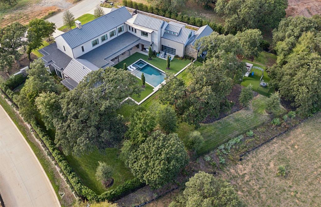 1502 Bluffview Drive Roanoke, TX 76262 - Photo 32 of 34 an aerial view of a house with a yard
