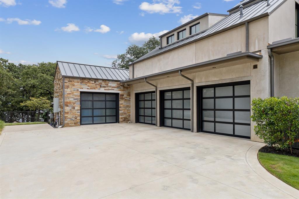 1502 Bluffview Drive Roanoke, TX 76262 - Photo 33 of 34 a view of an empty room with a garage