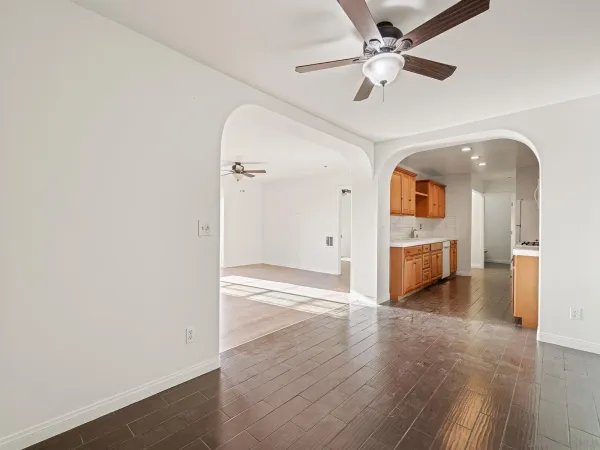 a view of a hallway with a kitchen
