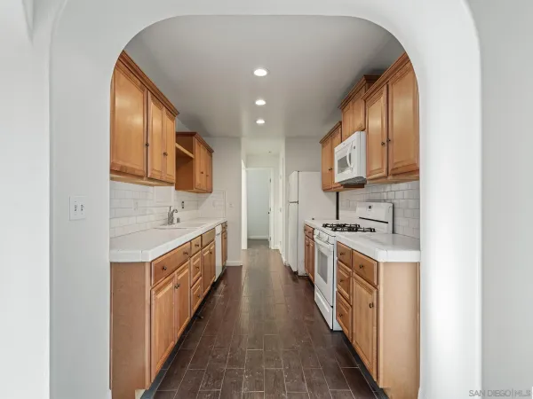 a kitchen with stainless steel appliances granite countertop a stove and a sink