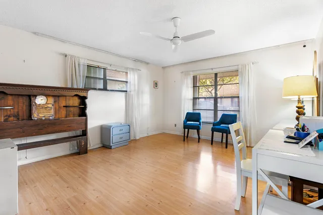 a living room with furniture and next to a window