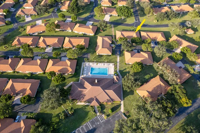 an aerial view of house with yard swimming pool and outdoor seating