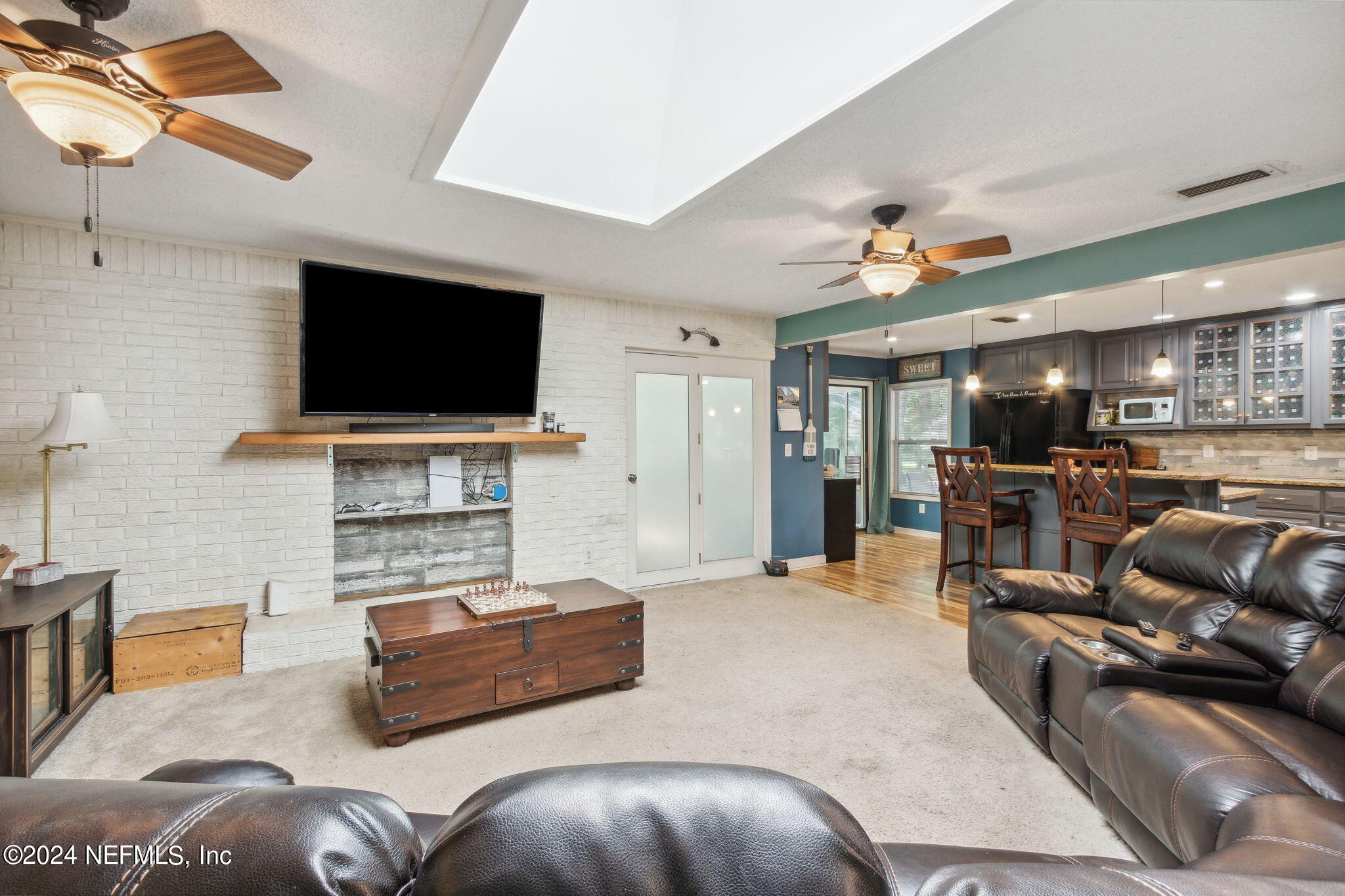97125 Pirates Point Road Yulee, FL 32097 - Photo 17 of 90 a living room with furniture and a flat screen tv