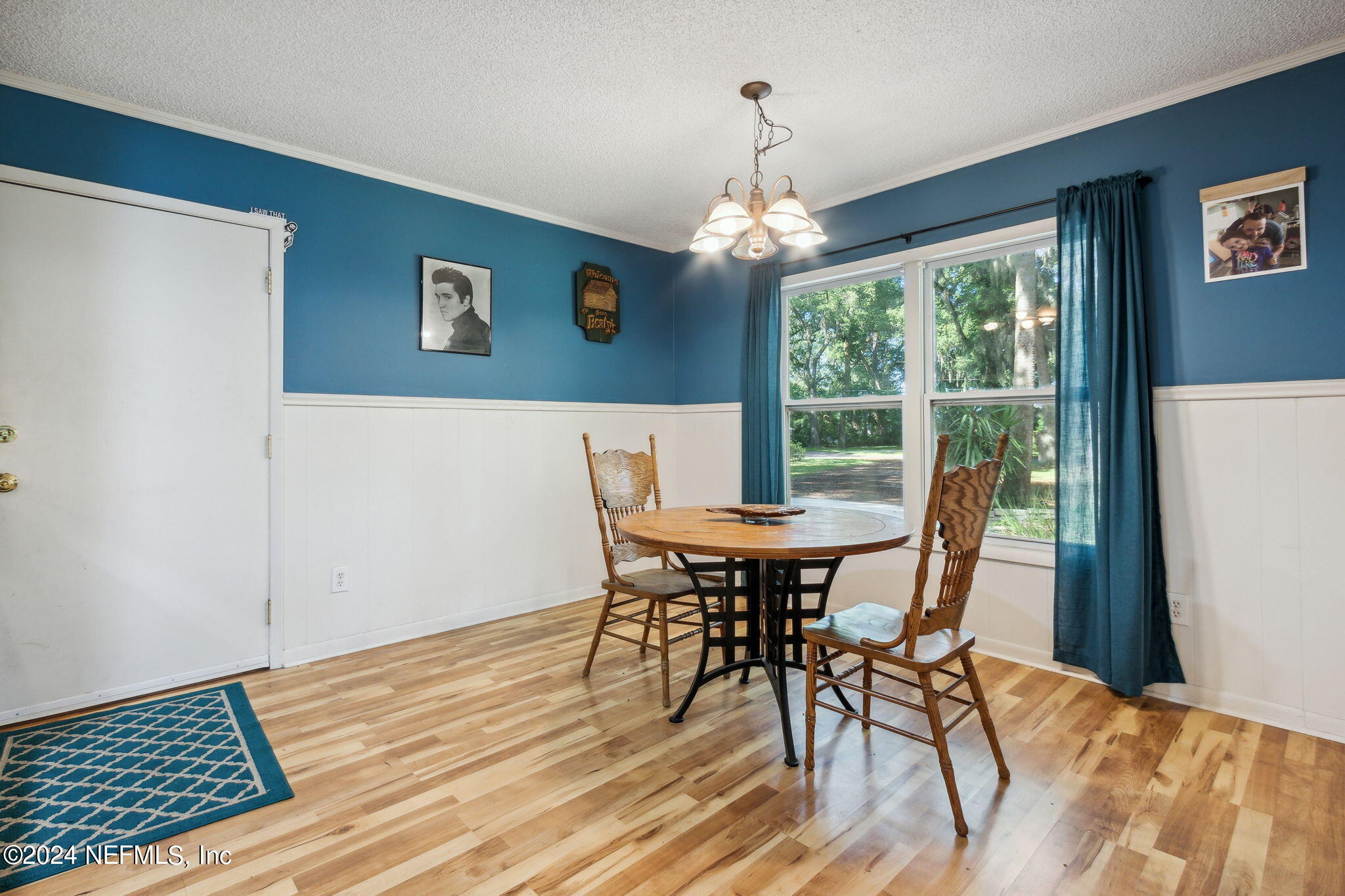 97125 Pirates Point Road Yulee, FL 32097 - Photo 27 of 90 a view of a dining room with furniture window and wooden floor