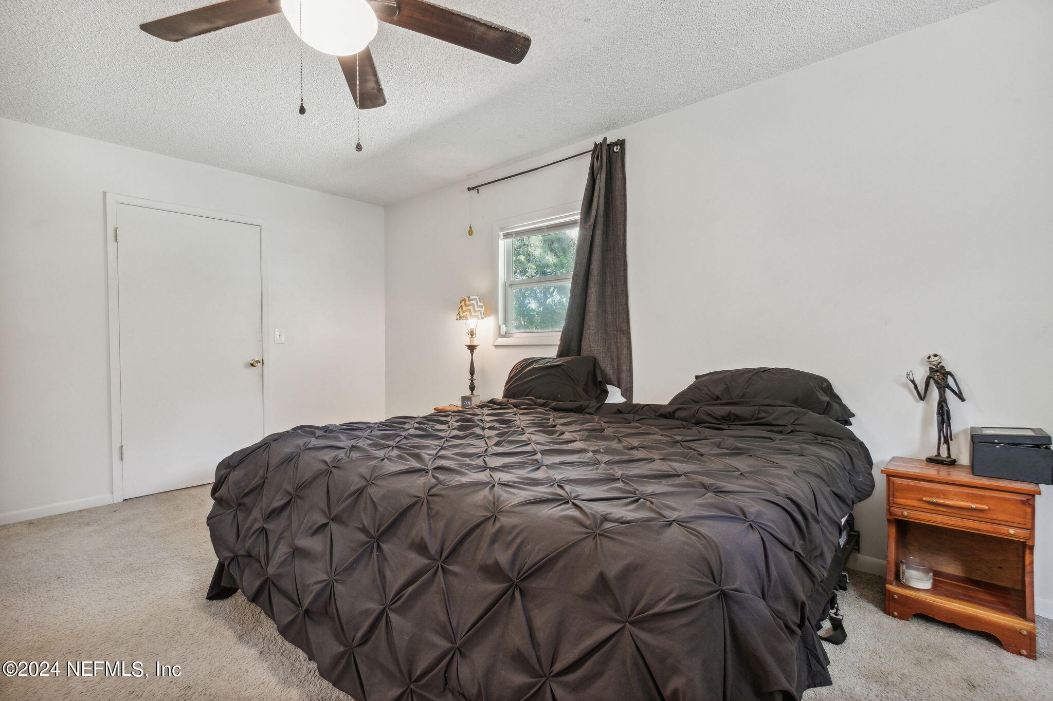 97125 Pirates Point Road Yulee, FL 32097 - Photo 36 of 90 a bedroom with bed and window